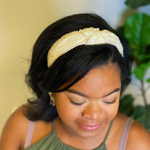 White pearl headband with elegant knot for bridal hairstyles