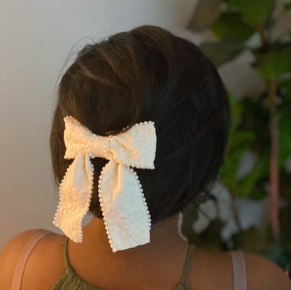  Elegant pearl bow barrette on model for bridal hairstyle