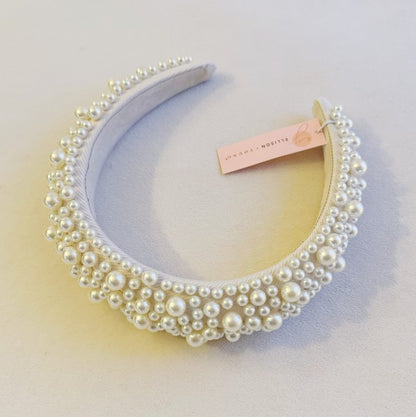 Elegant white pearl statement headband with volumized design for brides