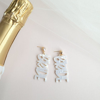 Gold bride earrings with hand-lettered calligraphy and zircon studs
