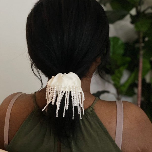 Elegant fringed hair scrunch with pearl details on model