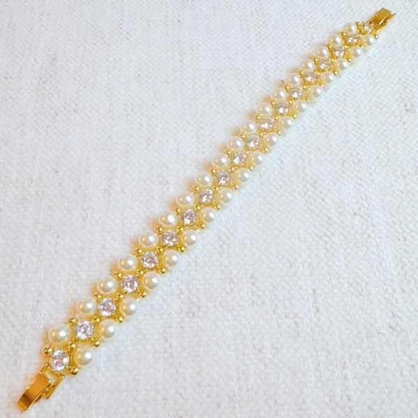 Gold pearl and crystal bracelet with elegant sparkle design