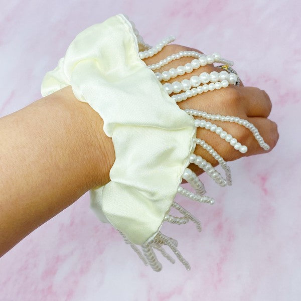 Close-up of hand-crafted pearl and bead hair scrunchie