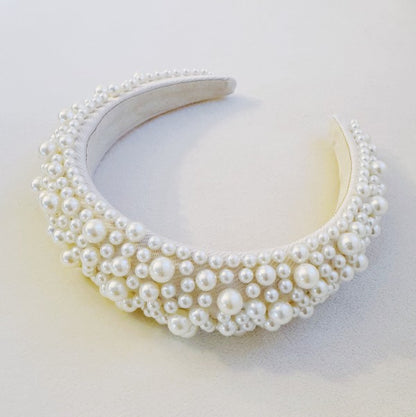 Elegant white pearl statement headband with volumized design for brides