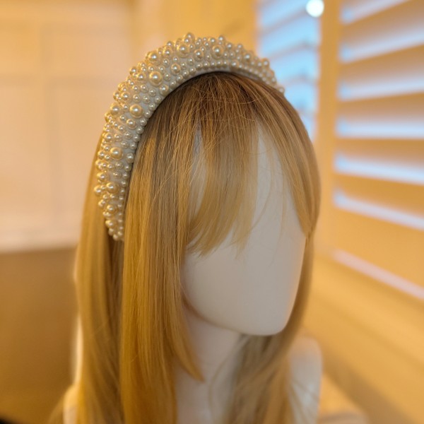 Elegant white pearl statement headband with volumized design for brides