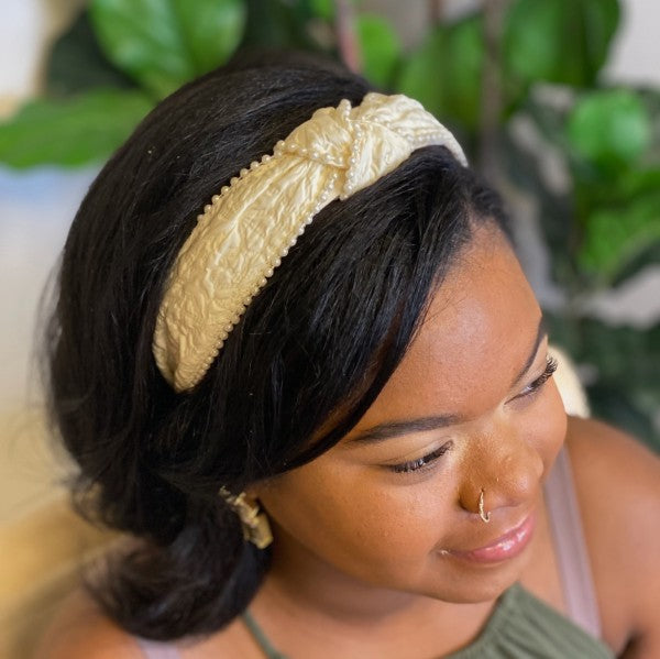 Side view of elegant pearl embellished wedding headband