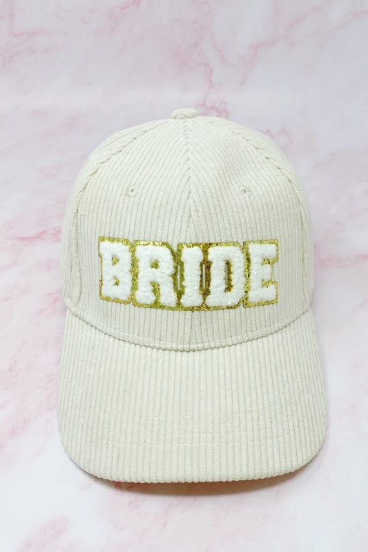 Cream corduroy bride baseball cap with gold glitter lettering
