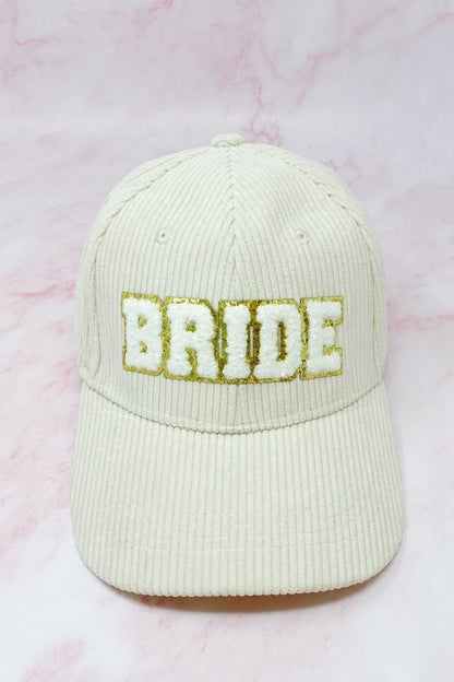 Cream corduroy bride baseball cap with gold glitter lettering
