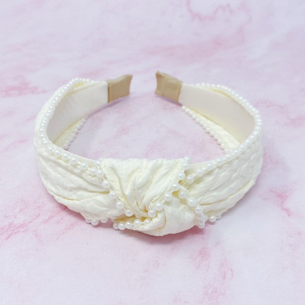 Knot pearl headband showing intricate embellishment details