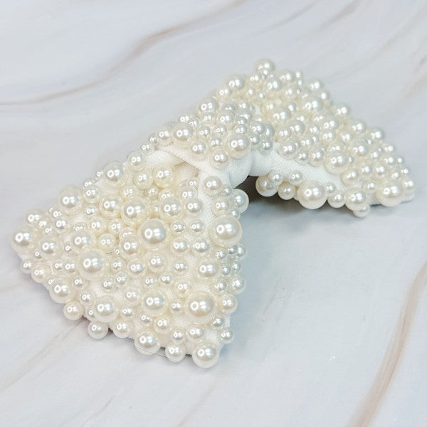 White pearl bow hair clip with elegant design for bridal hairstyles
