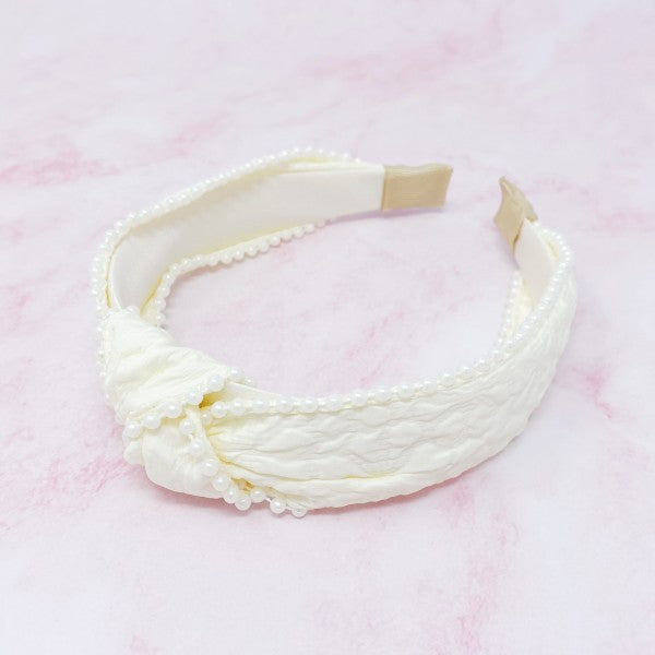 Pearl headband with knot design and embossed fabric texture