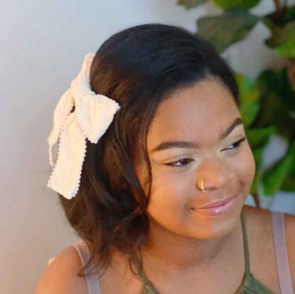  Elegant pearl bow barrette on model for bridal hairstyle