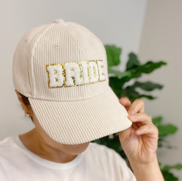 Cream corduroy bride baseball cap with gold glitter lettering
